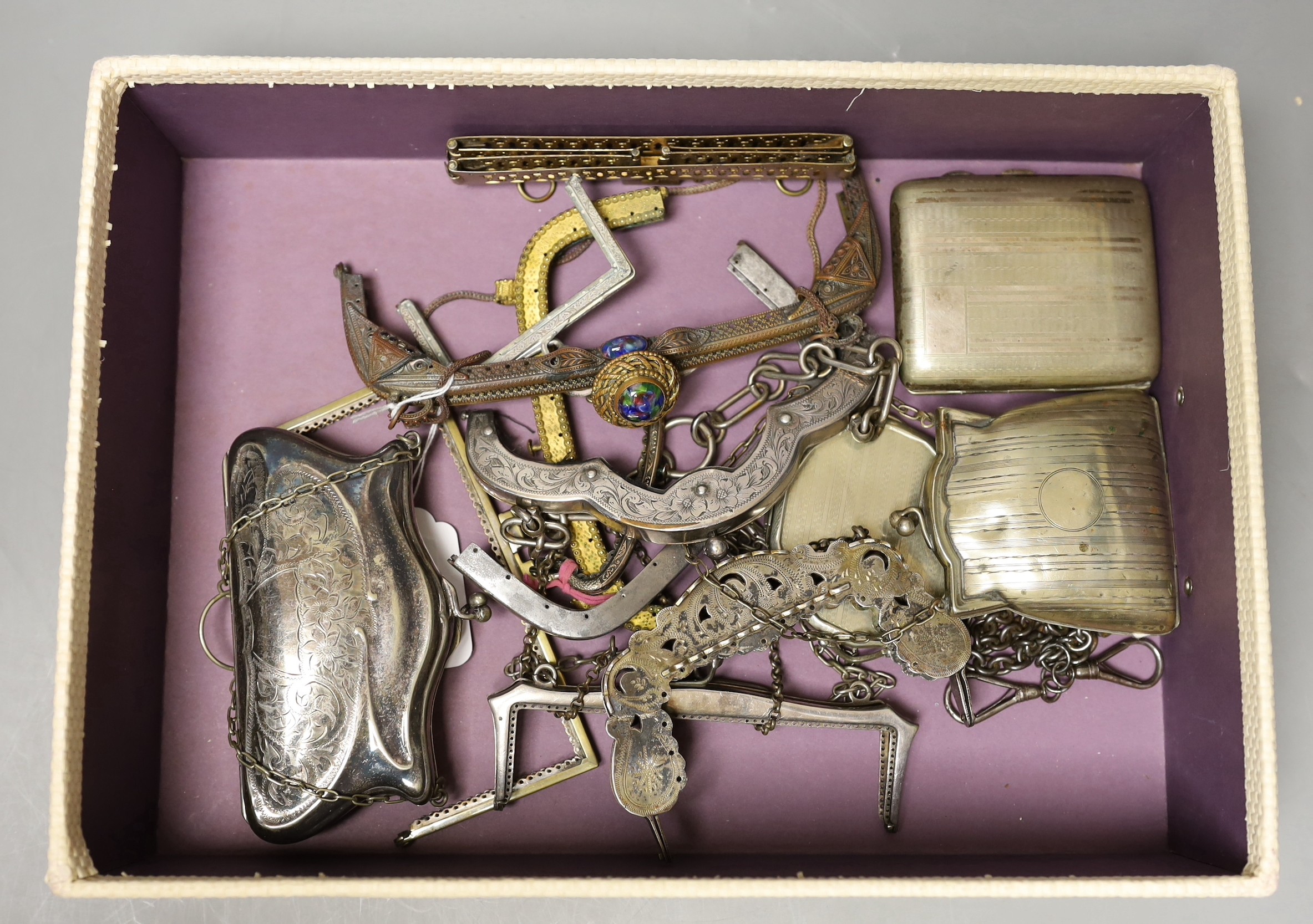 A collection of ten decorative 19th century and 20th century metal handbag frames, two Edwardian metal purses, a compact and cigarette case